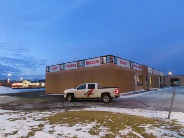 A small retail building with display windows — commercial building inspected by Nordic Inspections in Moorhead, MN.