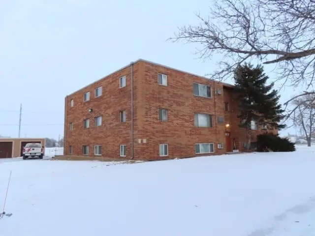 A walk-up apartment building with a shared entrance, a commercial building inspected by Nordic Inspections in West Fargo, ND.