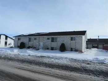 A walk-up apartment building with a shared entrance — commercial building inspected by Nordic Inspections in West Fargo, ND.