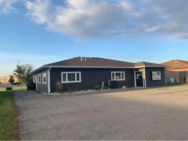 A single-story office building with a front parking lot, a commercial building inspected by Nordic Inspections in West Fargo, ND.