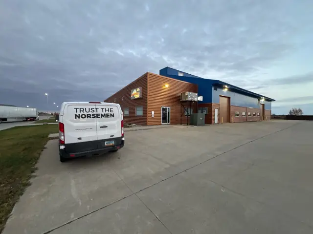 An office/warehouse building with overhead doors — commercial building inspected by Nordic Inspections in West Fargo, ND.