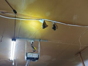 Garage door opener with the safety photo eyes mounted up at the ceiling instead of near the floor